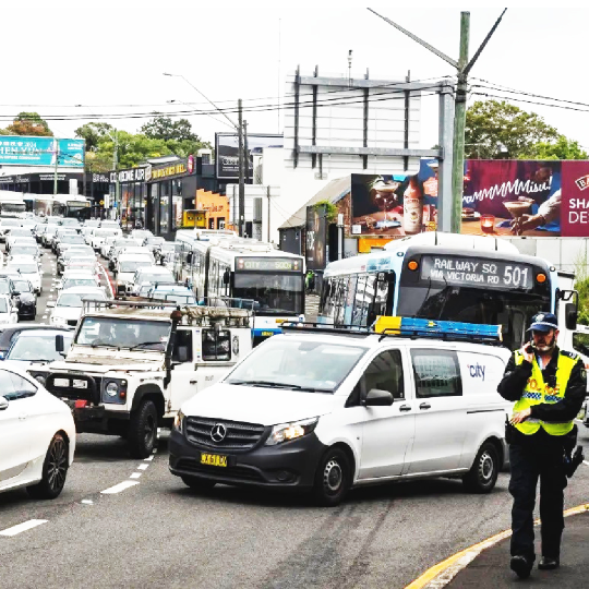 Traffic jam on a busy road with a policer officer standing in the foreground